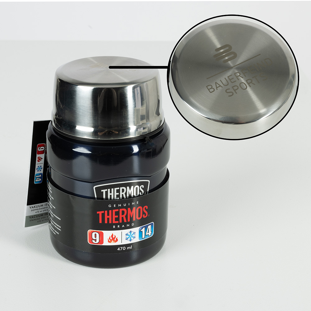 Thermos food container with engraved Bauerfeind Sports logo on the lid. The container keeps food hot for up to 9 hours and cold for up to 14 hours. Black design with stainless steel lid and integrated spoon, ideal for meals on the go.