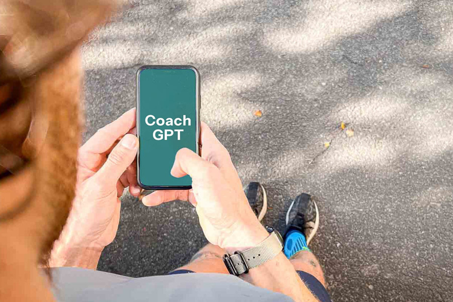 A runner holds a smartphone displaying "Coach GPT." The scene highlights the use of AI technology for support during running training.