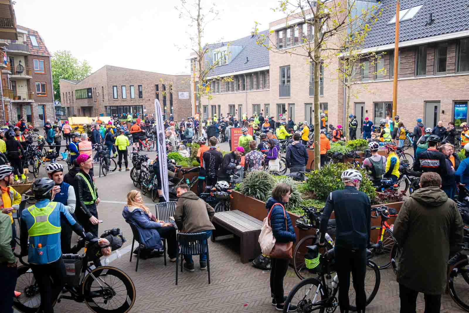 Many different cyclists stand in the starting area of the ultra-cycling event Race around the Netherlands