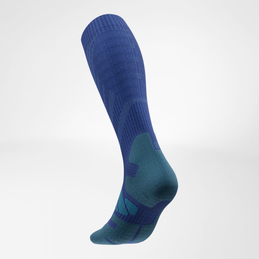 Lateral back view of the merino hiking socks in dark blue