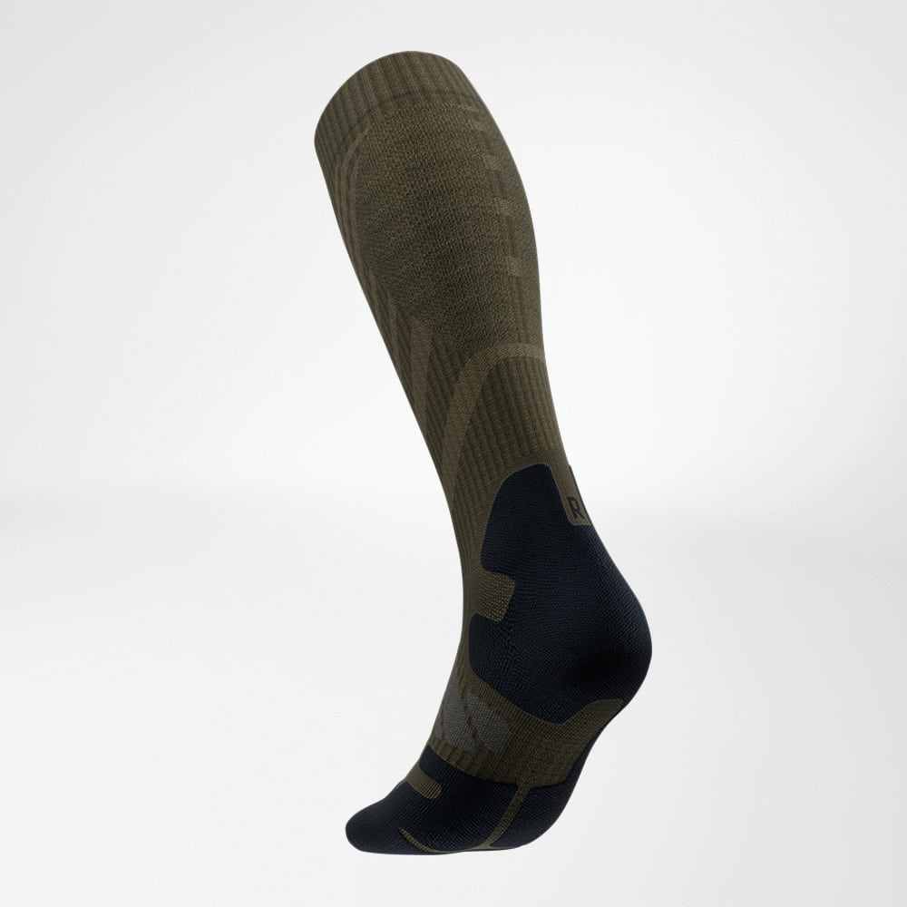 Lateral back view of the merino hiking socks in dark green