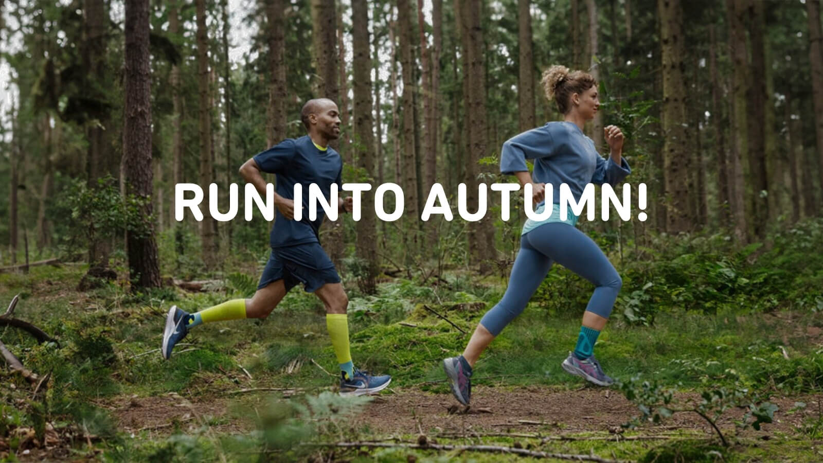 A woman and a man are running through a dense forest, wearing bandages